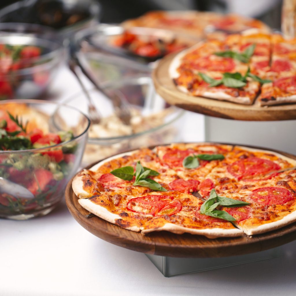 There Are Many Different Freshly Prepared Pizzas On The Buffet T